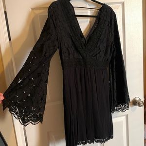 Large black lace dress.